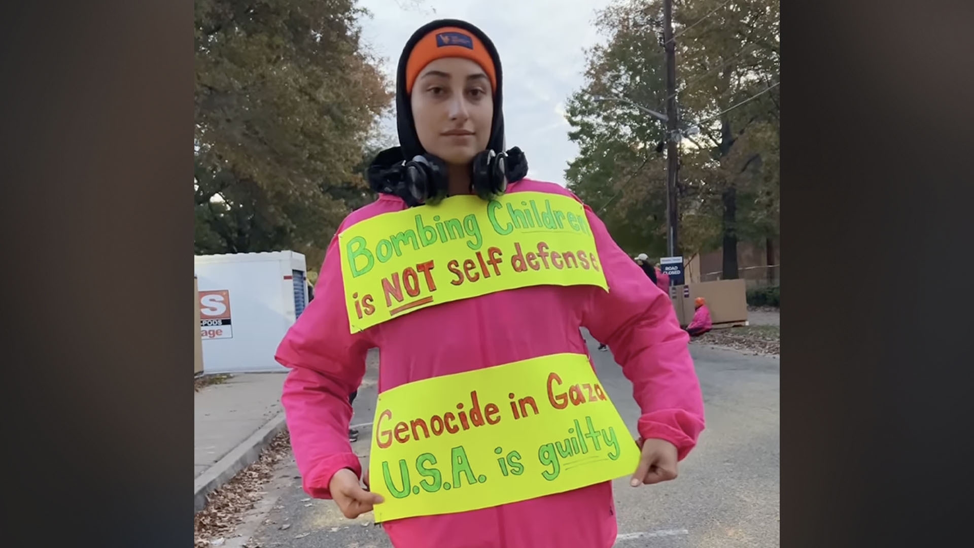 Briana Navarro in her New York City Marathon jacket with pro-Palestine signs taped to it (Photo: Briana Navarro)