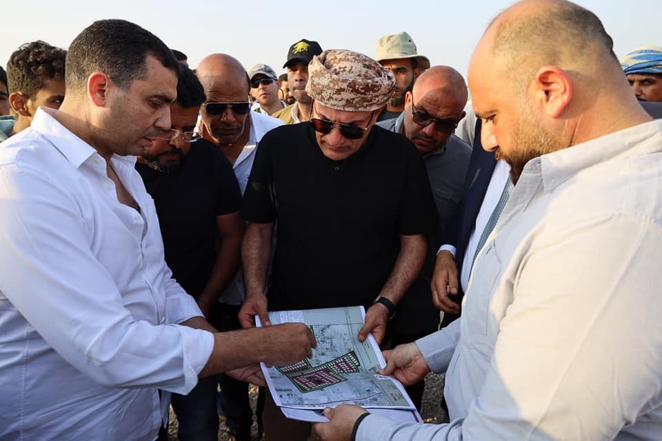 Ibrahim al-Organi (C) looking at construction plans during the event inaugurating the Sisi City and Union of Arab Tribes, 1 May 2024 (Facebook/Alorgani)