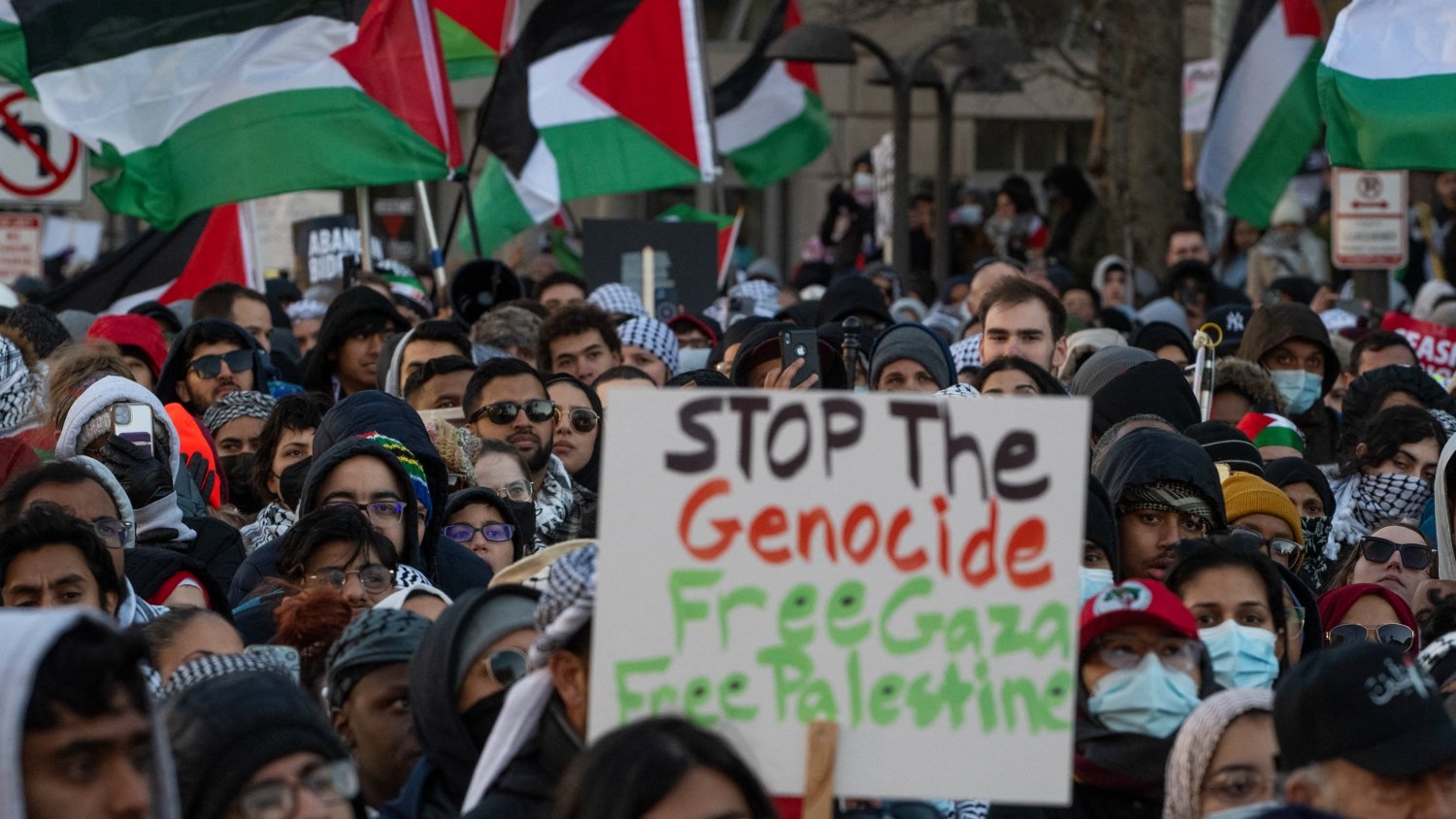 Pro-Palestinian demonstrators listen to speakers during the "March on Washington for Gaza" in Washington on 13 January 2024.