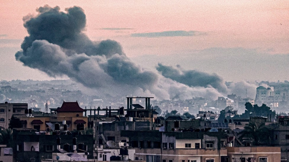 Smoke billows during an Israeli bombardment of Khan Younis, Gaza, on 3 January 2024 (AFP)