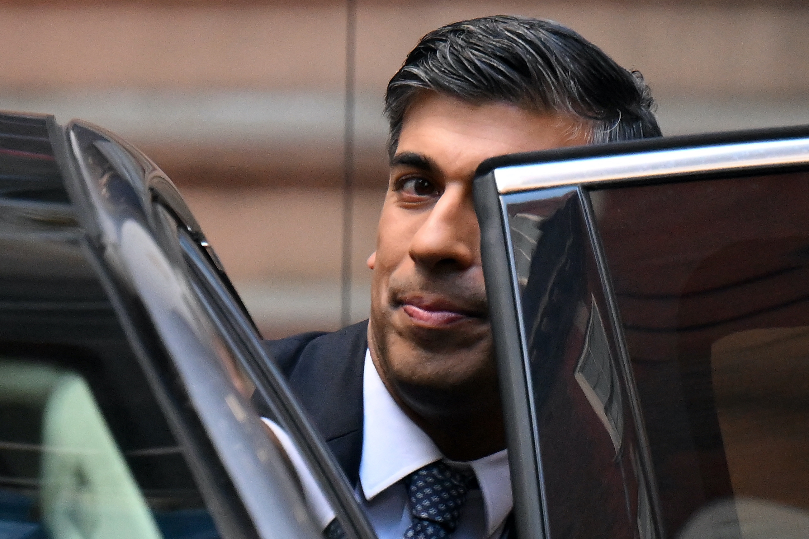 Rishi Sunak leaves Conservative Party HQ in London having been announced as the winner of the party's leadership contest, 24 October 2022 (AFP)