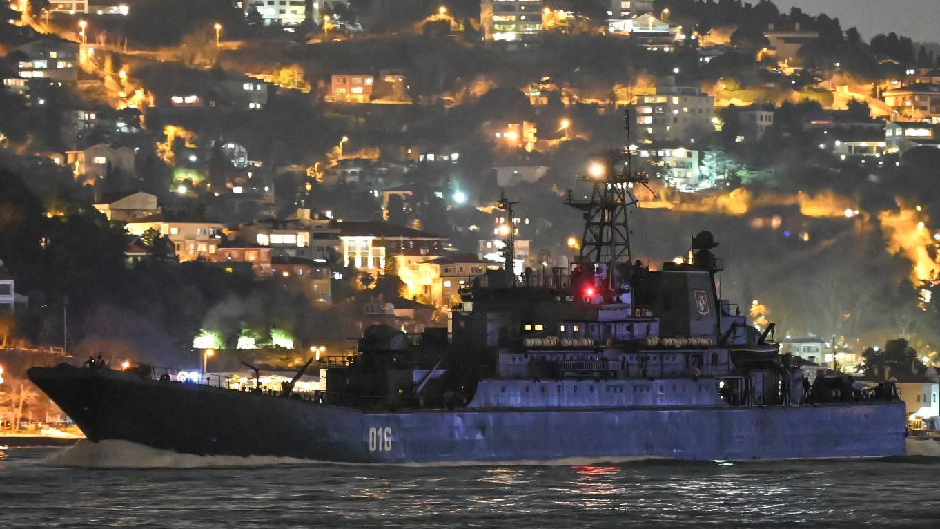 A Russian navy vessel sails through the Bosphorus Strait en route to the Black Sea past the city of Istanbul on 9 February 2022.