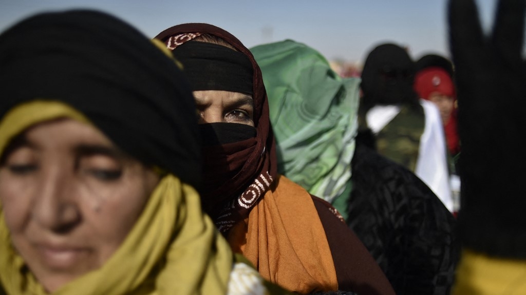Displaced Sahrawis arrive to attend a Polisario congress at the refugee camp of Dakhla, which lies some 170km to the southeast of the Algerian city of Tindouf, on 13 January 2023 (AFP)