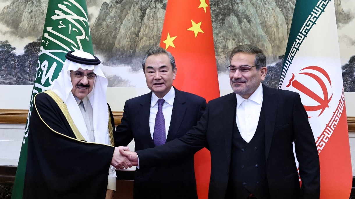 Wang Yi, China's most senior diplomat, Ali Shamkhani, the secretary of Iran’s Supreme National Security Council, and Saudi national security adviser Musaad bin Mohammed Al Aiban pose for pictures during a meeting in Beijing, China 10 March 2023.