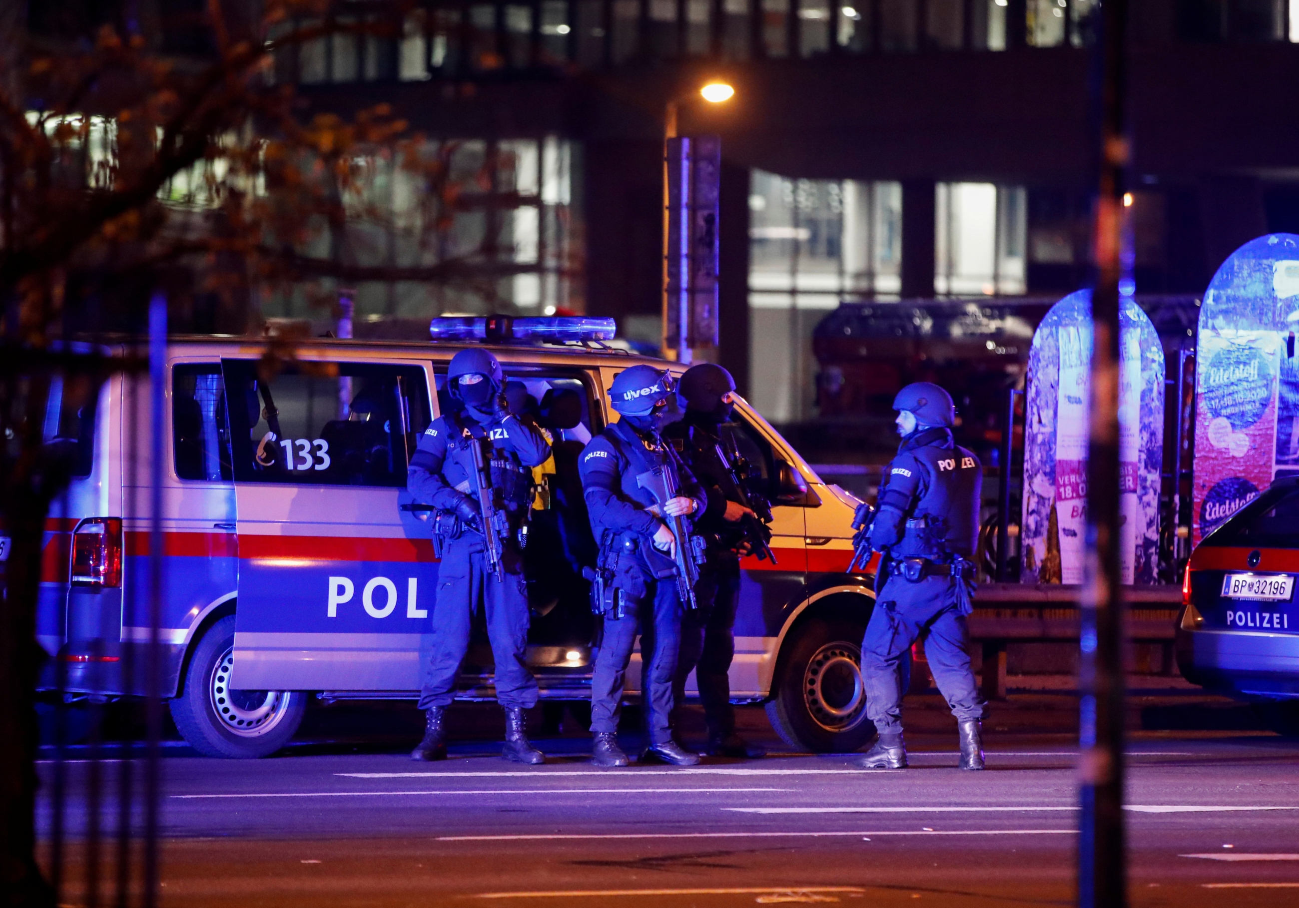 Police officers stand guard on a street after exchanges of gunfire in Vienna, Austria on 3 November 2020.