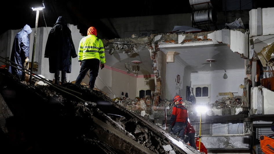 Rescuers search for survivors at the site of a collapsed building, following an earthquake, in Osmaniye, Turkey, on 6 February 2023.