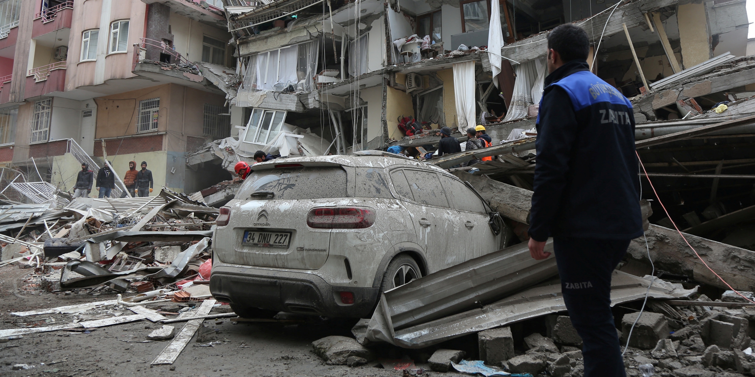 Rescuers search for survivors at a damaged building following an earthquake in Diyarbakir, Turkey on 6 February 2023.