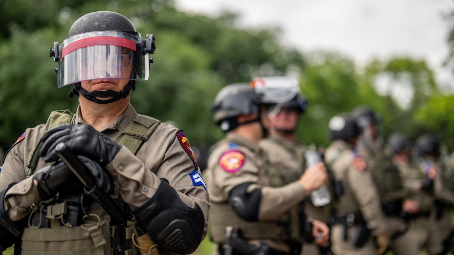 Law enforcement work to contain a demonstration during a pro-Palestinian protest at the University of Texas at Austin on 24 April 2024 in Austin, Texas.