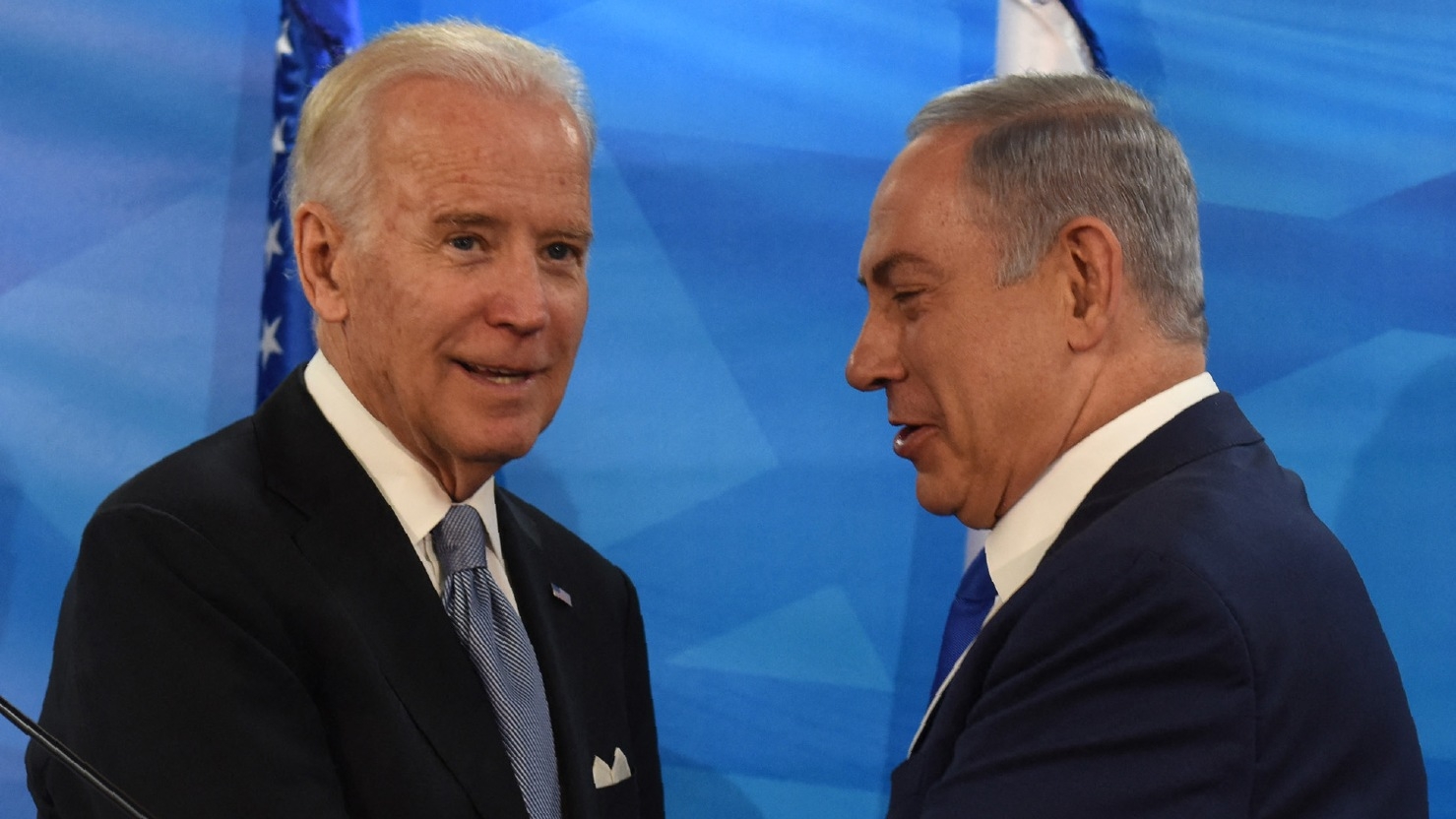 Then-US Vice President Joe Biden and Israeli Prime Minister Benjamin Netanyahu shake hands after giving joint statements in the prime minister's office on 9 March 2016.