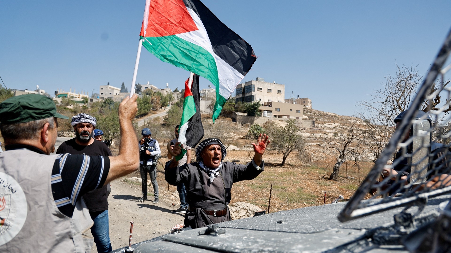 A Palestinian reacts during a protest against Israeli settlements near Nablus in the Israeli-occupied West Bank 15 September 2023 (Reuters)