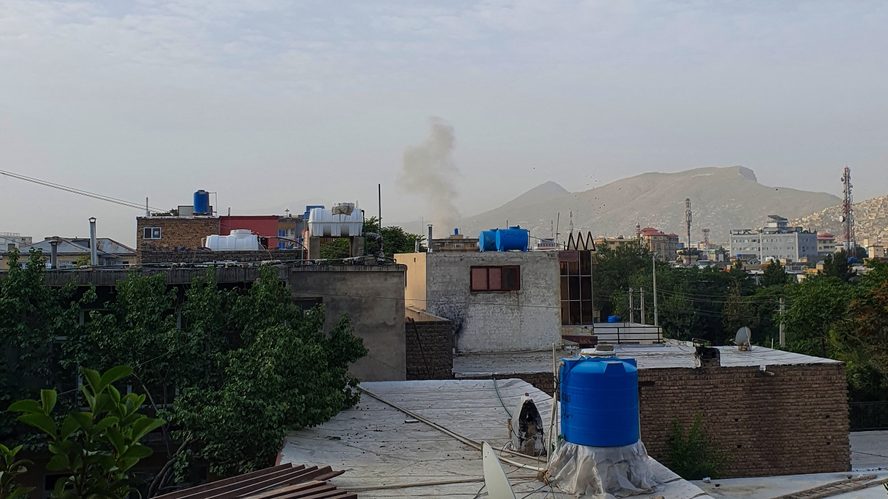 Smoke rises from a house following a US drone strike in the Sherpur area of Kabul on the 31 July 2022 (AFP)