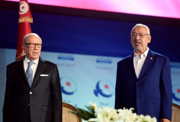 Tunisian President Beji Caid Essebsi (L) and Islamist Ennahda Party leader Rached Ghannouchi (R) on 20 May, 2016 at the opening of Ennahda's three-day congress in Tunis (AFP)