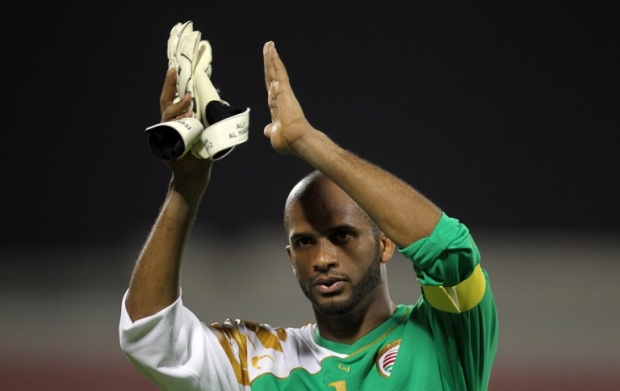 Oman's goalkeeper Ali Al-Habsi claps to the crowd at the end of his team's 2014 World Cup Asian qualifying football match in Doha on 12 June, 2012 (AFP)