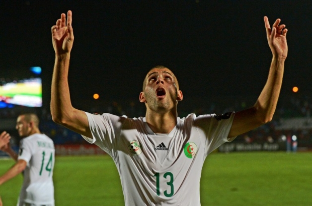 Algeria's forward Islam Slimani celebrates after scoring a goal during the 2015 African Cup of Nations group C football match in Mongomo on 19 January (AFP)