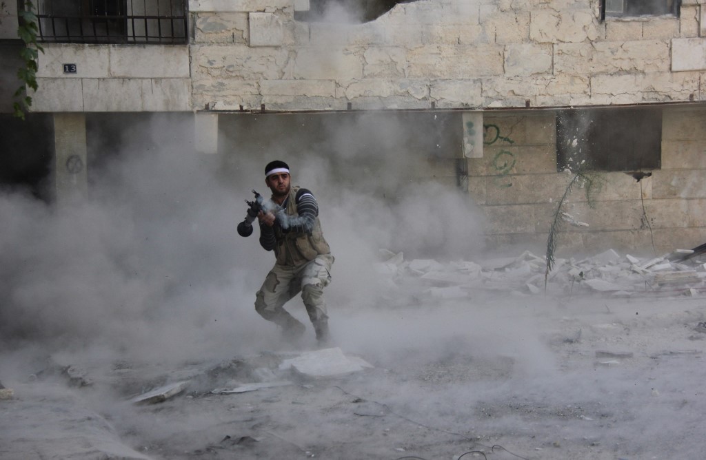 A Syrian opposition fighter fires an RPG during clashes in Aleppo in 2013 (AFP)