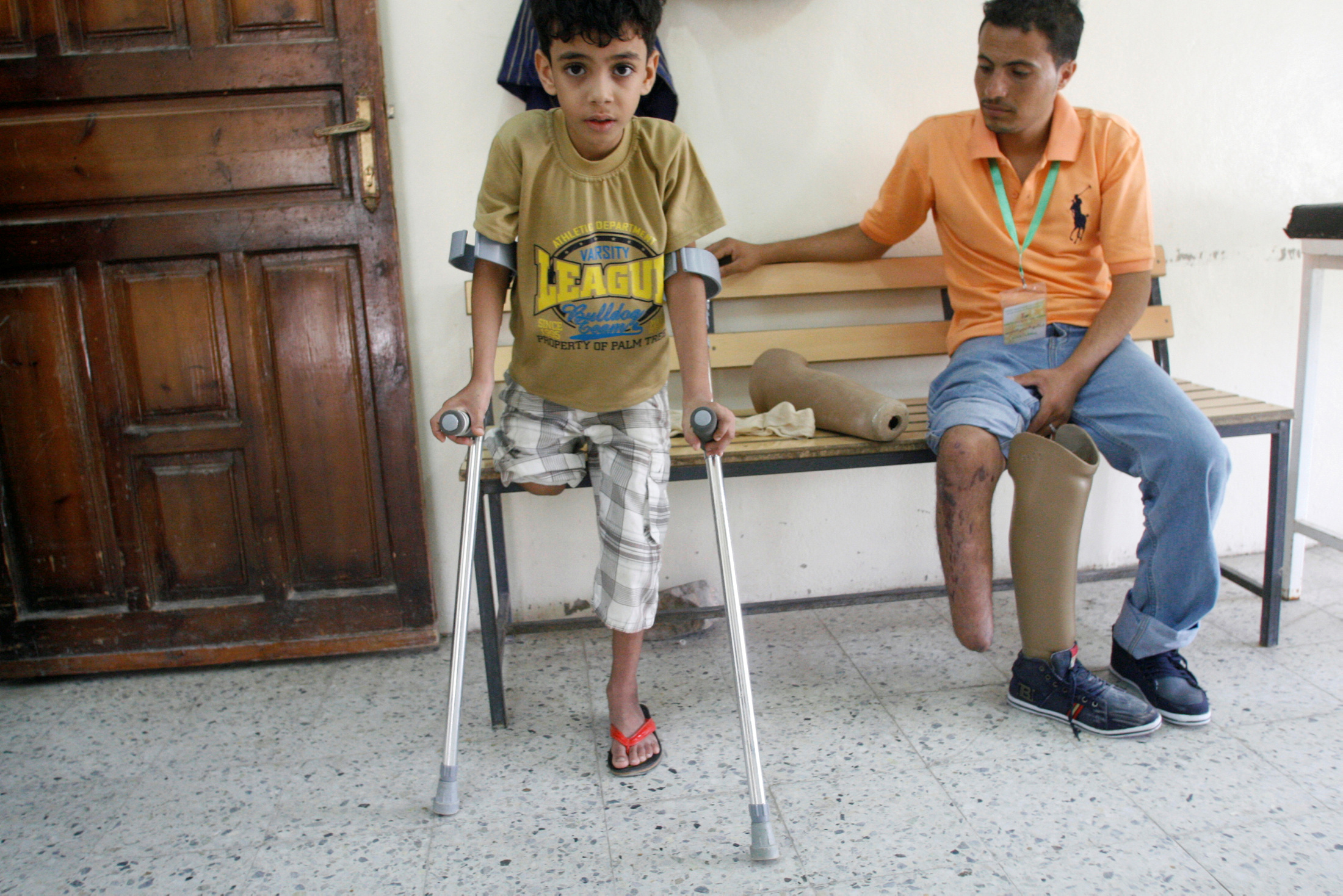 People with amputated legs are pictured at a prosthetic limbs centre in Taiz in May 2016 (Reuters)