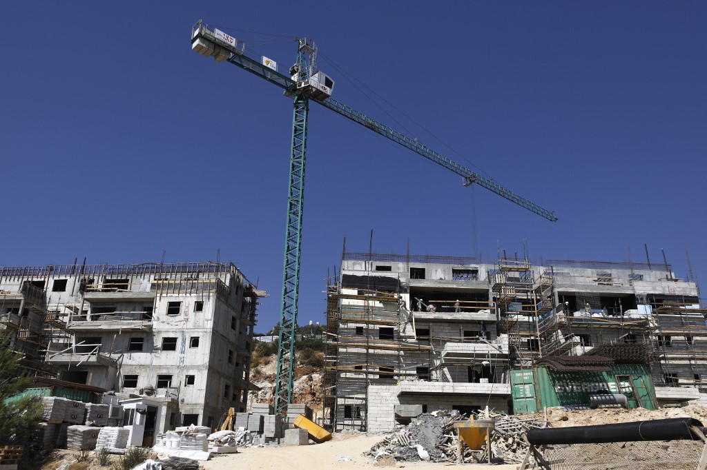 Construction continues at the Israeli Talmon settlement, north of Ramallah, on 31 July (AFP)