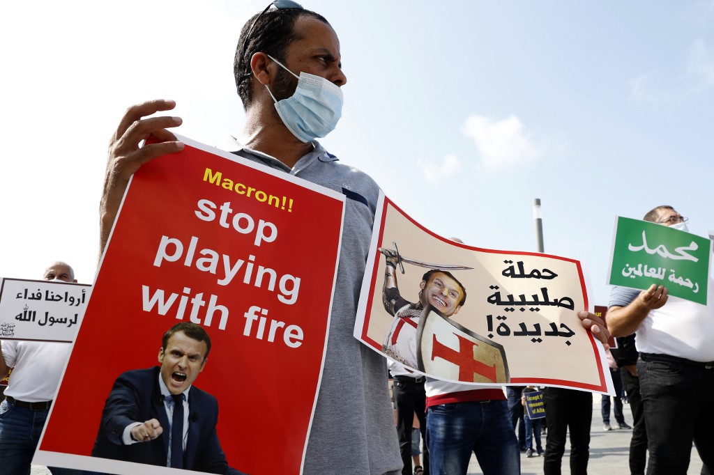 Muslim demonstrators protest against Macron in Tel Aviv on 27 October (AFP)