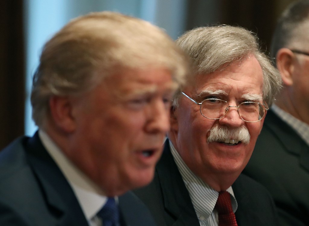 US President Donald Trump and his former national security adviser, John Bolton, are pictured in Washington in April 2018 (AFP)