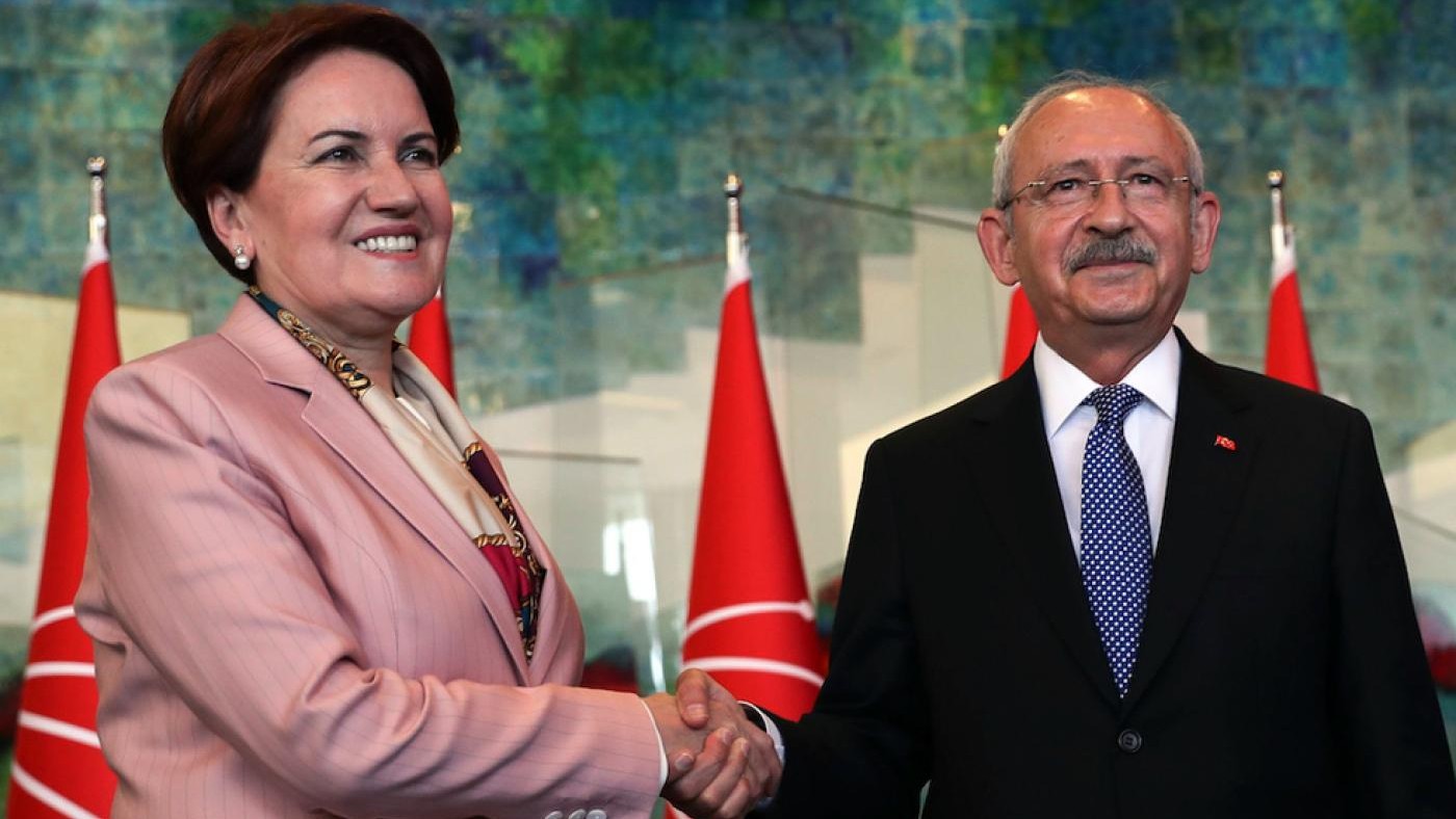 Chairman of the Republican People's Party (CHP) Kemal Kilicdaroglu shakes hands with the Leader of the Iyi party Meral Aksener (AFP)