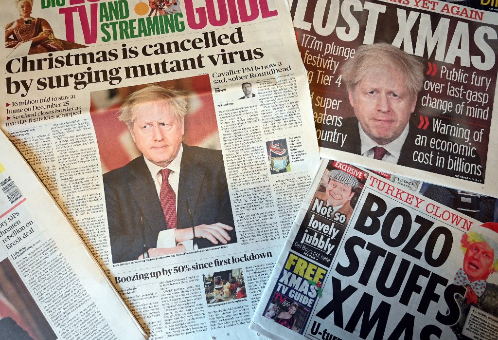 An arrangement of UK daily newspapers is pictured in December 2020 (AFP)
