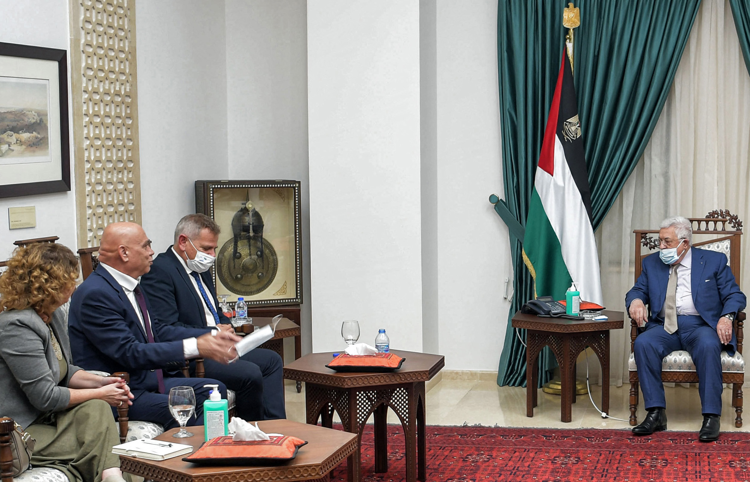 Palestinian President Mahmud Abbas (R) meets with Israel's ministers of health, Nitzan Horowitz (3rd-L), regional cooperation, Issawi Frej (2nd-L) and deputy Michal Rozin (L), in Ramallah, 3 October 2021