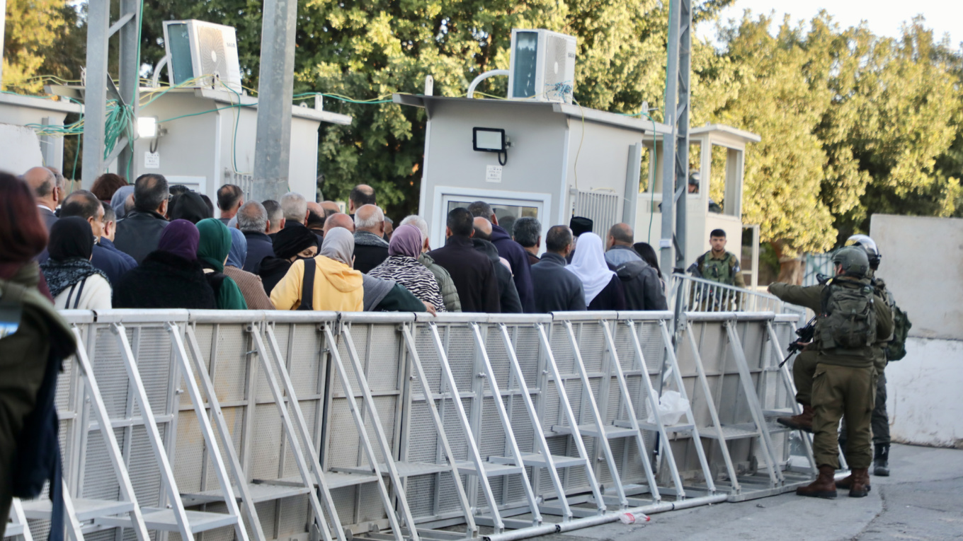 Palestinians queuing at a checkpoint in Bethlehem, hoping to reach Al-Aqsa Mosque (Mosab Shawer/MEE)