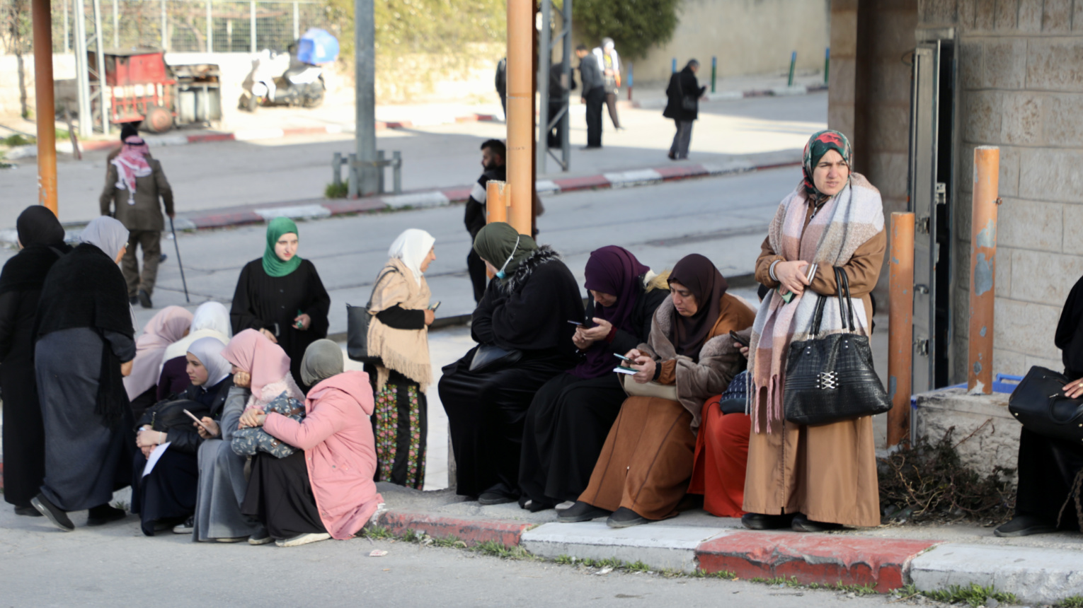 Women wait in Bethlehem, hoping to be granted access to Al-Aqsa Mosque (Mosab Shawer/MEE).