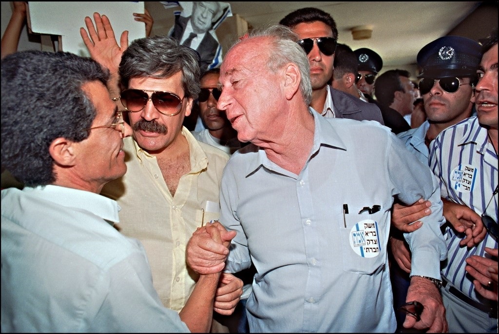 Then Israel's Labor party leader Yitzhak Rabin (c) is greeted by supporters in 1992 during an election campaign stop in a right-wing Likud party stronghold settlement of Maale Adumin (AFP)